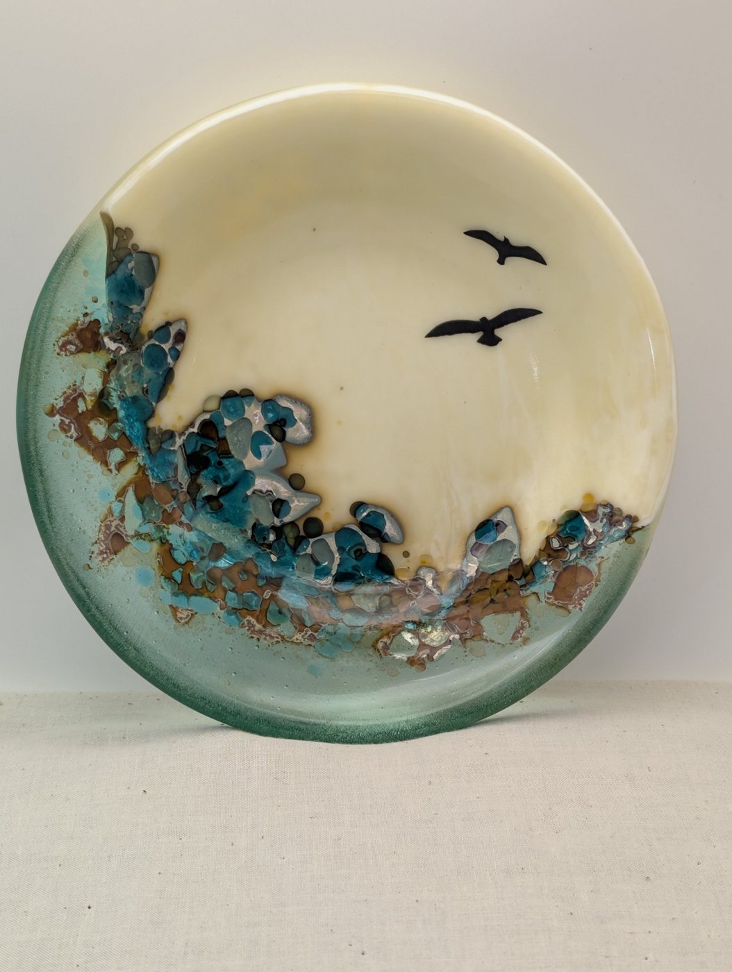 Ivory fused glass plate with two birds in flight