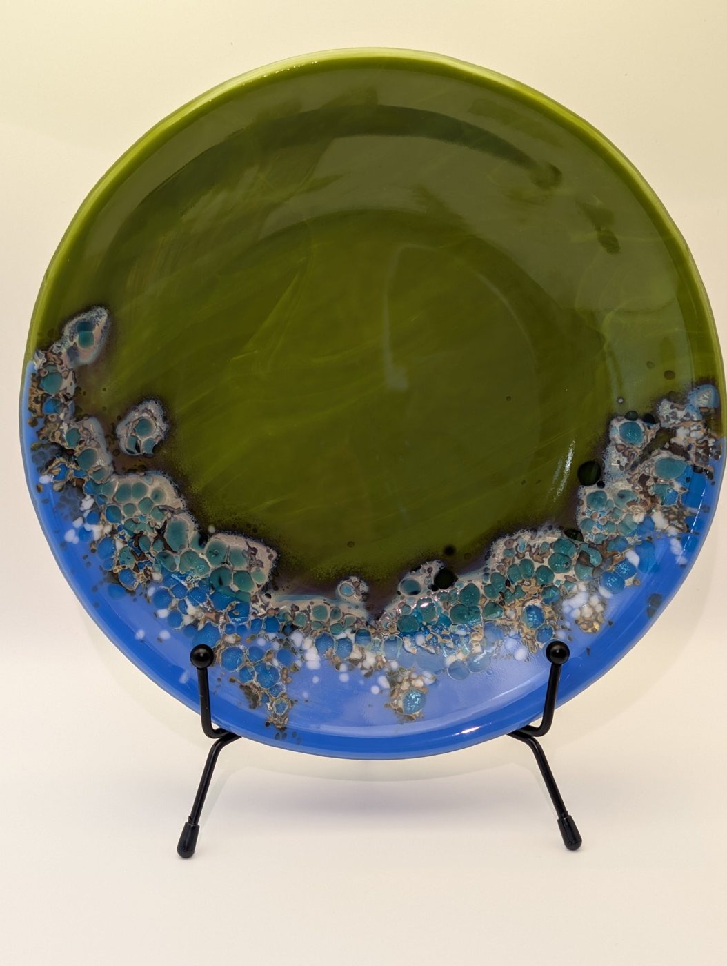 Olive and blue fused glass plate on a stand